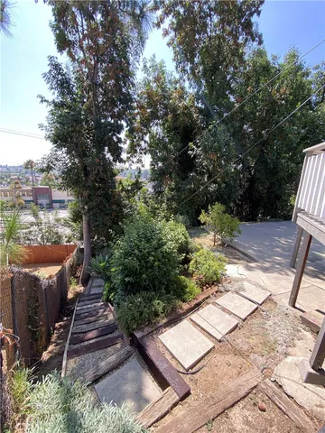 a view of a chairs and tables in the backyard