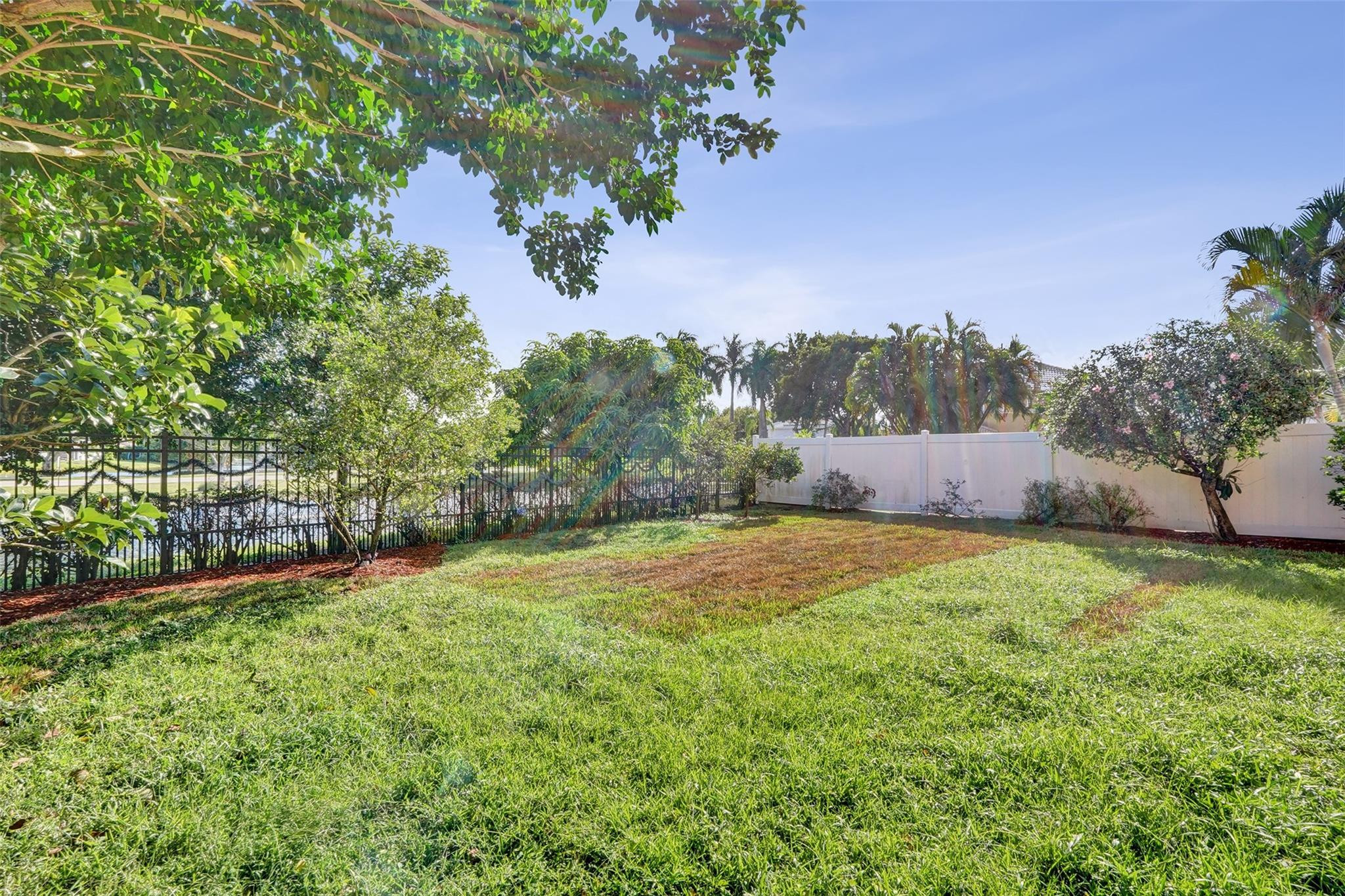 10902 Tamoron Lane Boca Raton, FL 33498 - Photo 57 of 66 a backyard of a house