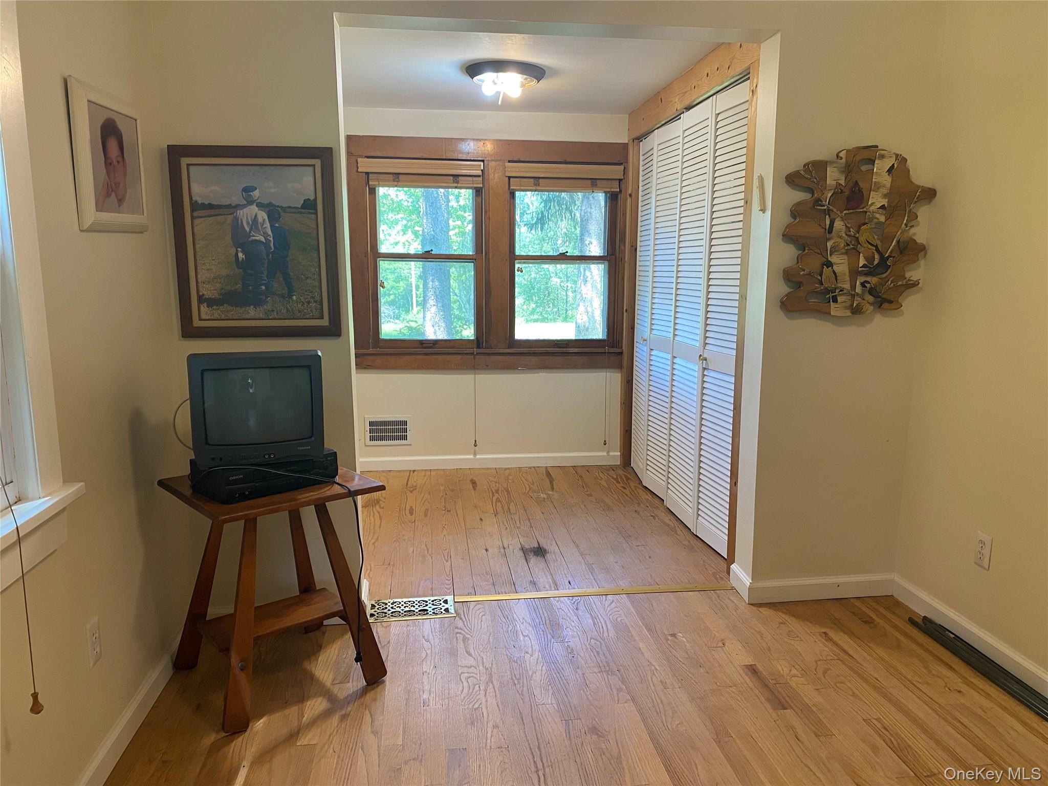 13 Fisher Road Cochecton, NY 12726 - Photo 20 of 32 an empty room with wooden floor and windows