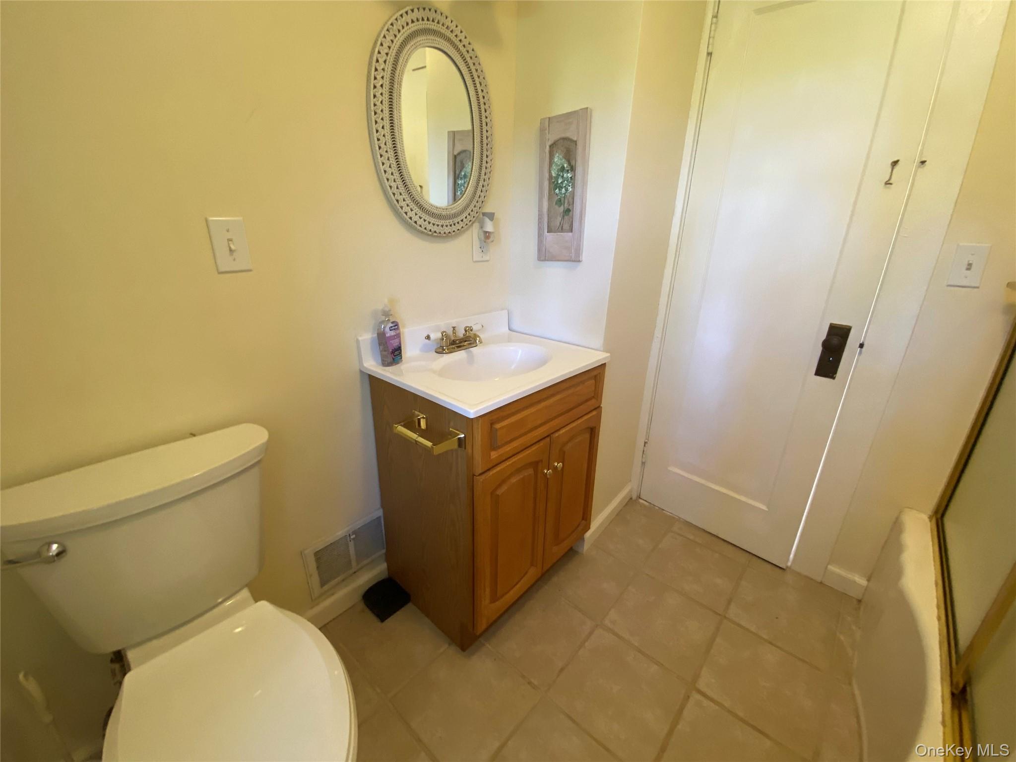 13 Fisher Road Cochecton, NY 12726 - Photo 23 of 32 a bathroom with a sink a toilet and a mirror
