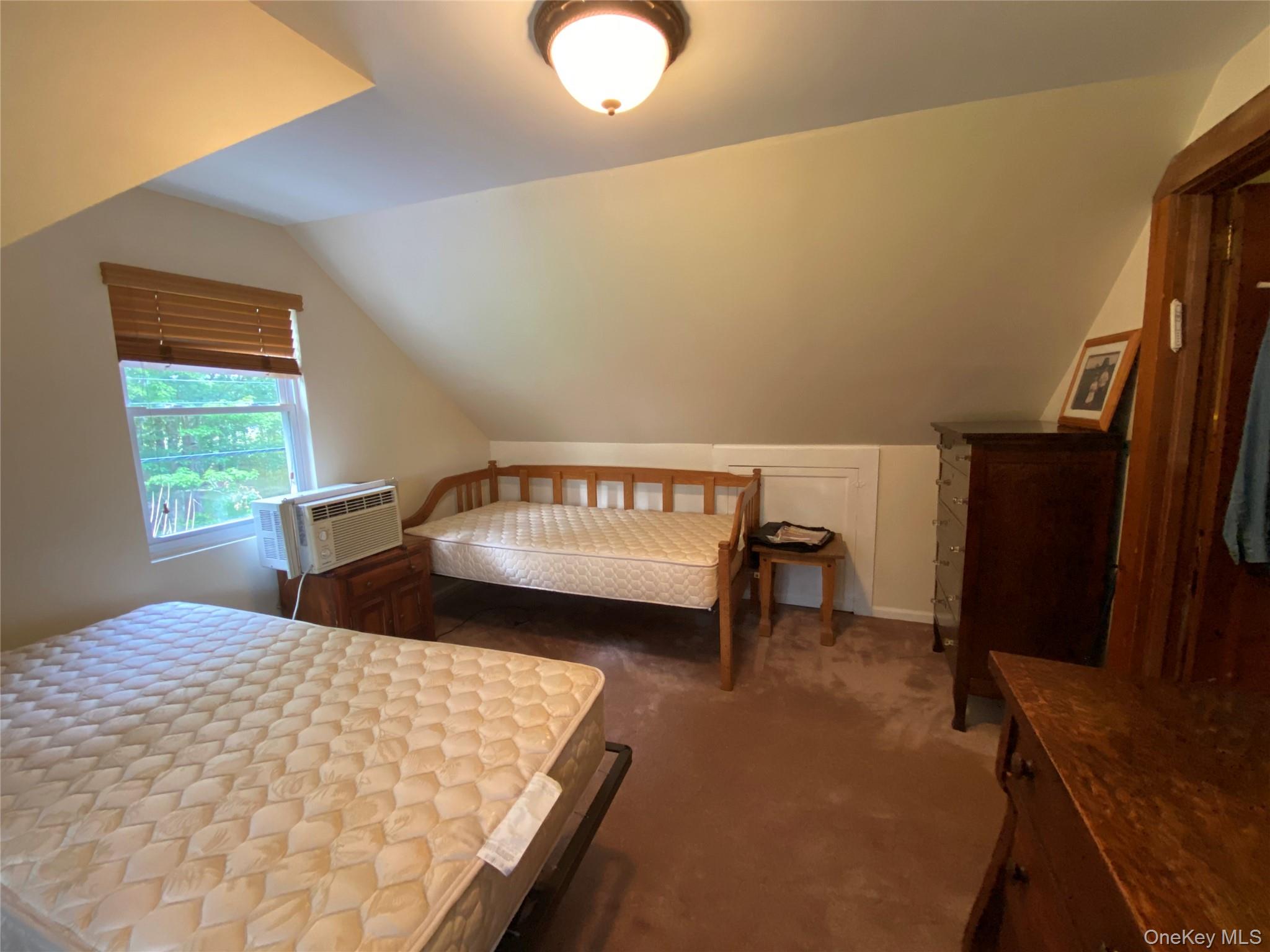 13 Fisher Road Cochecton, NY 12726 - Photo 26 of 32 a bedroom with a bed and a window