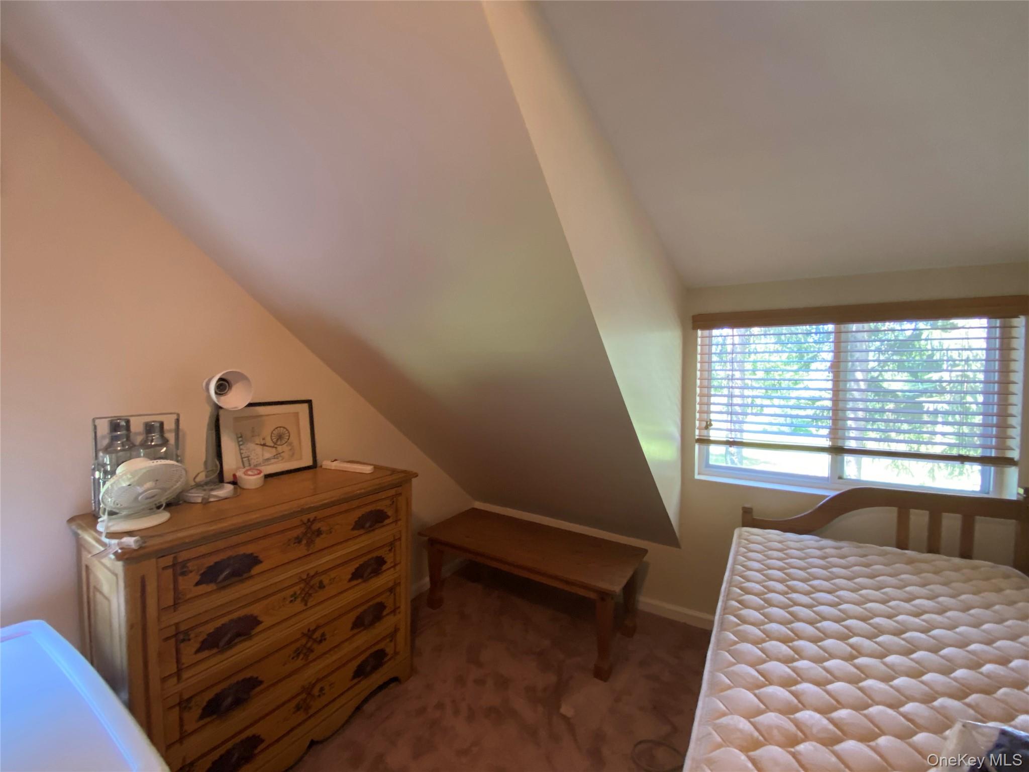 13 Fisher Road Cochecton, NY 12726 - Photo 30 of 32 a bedroom with a bed and a window