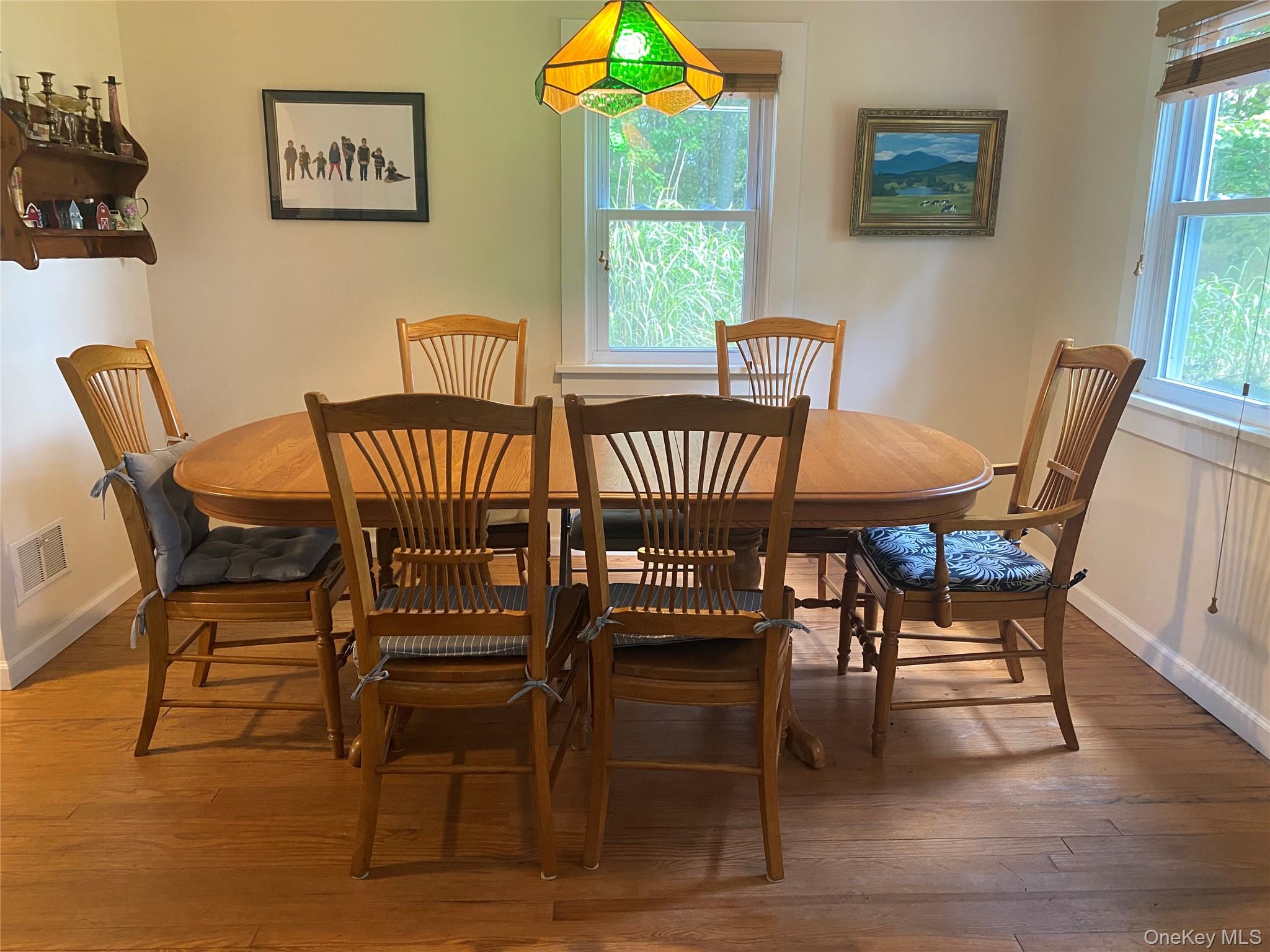 13 Fisher Road Cochecton, NY 12726 - Photo 7 of 32 a view of a dining room with furniture wooden floor and a chandelier