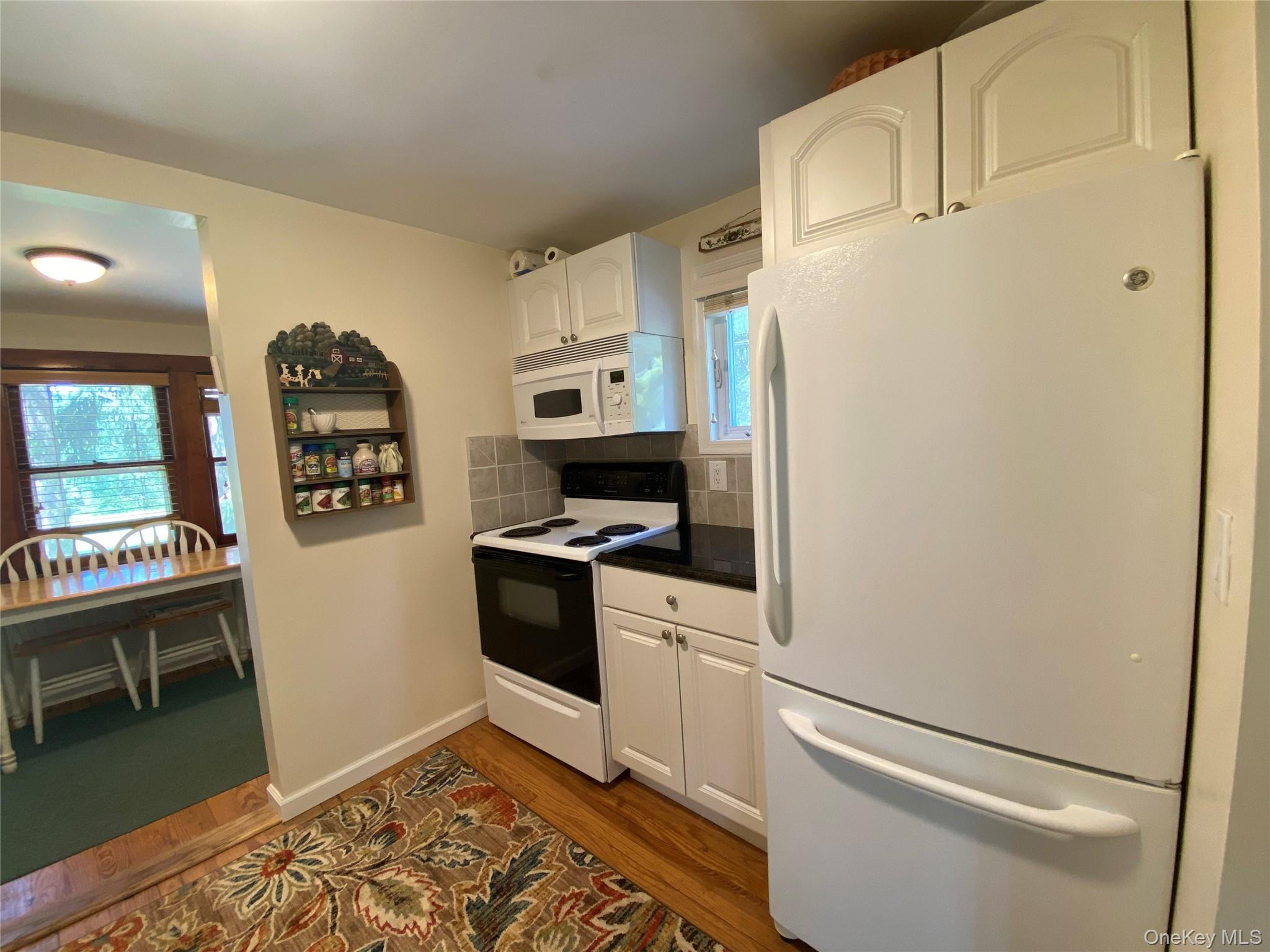 13 Fisher Road Cochecton, NY 12726 - Photo 9 of 32 a kitchen with stainless steel appliances a refrigerator sink and cabinets