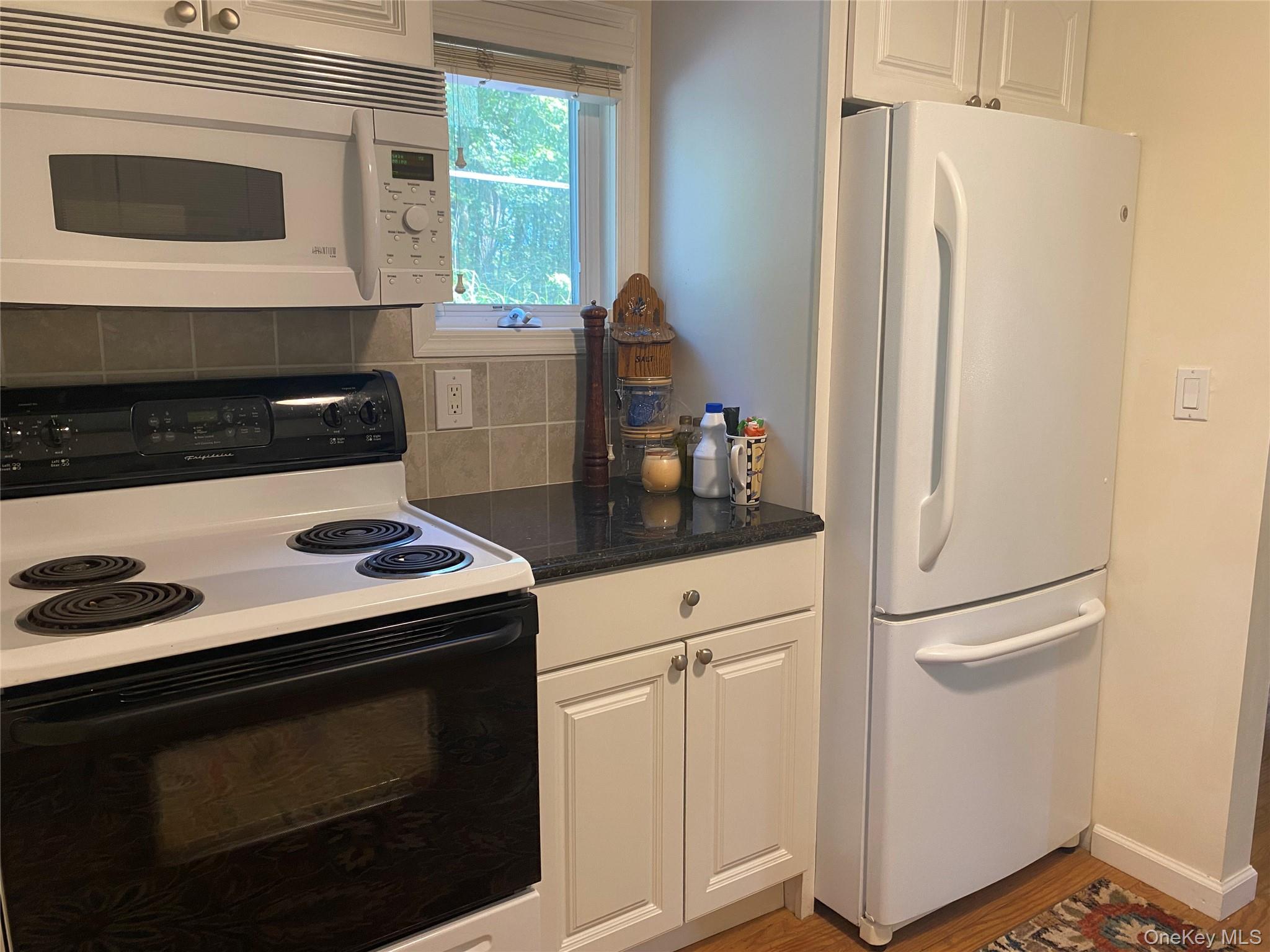 13 Fisher Road Cochecton, NY 12726 - Photo 10 of 32 a kitchen with a stove and a refrigerator