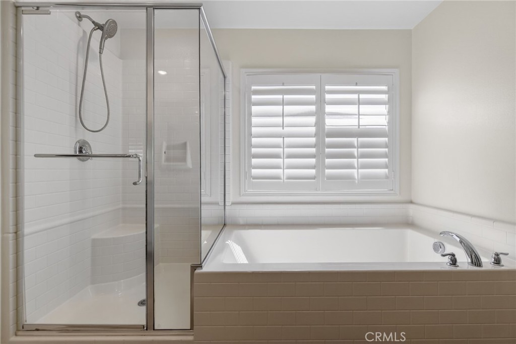 19435 Fortunello Avenue Riverside, CA 92508 - Photo 36 of 51 a bathroom with a bath tub and a shower