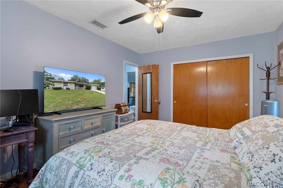 3355 South Highlands Avenue Inverness, FL 34452 - Photo 20 of 30 a bedroom with a bed and a flat screen tv