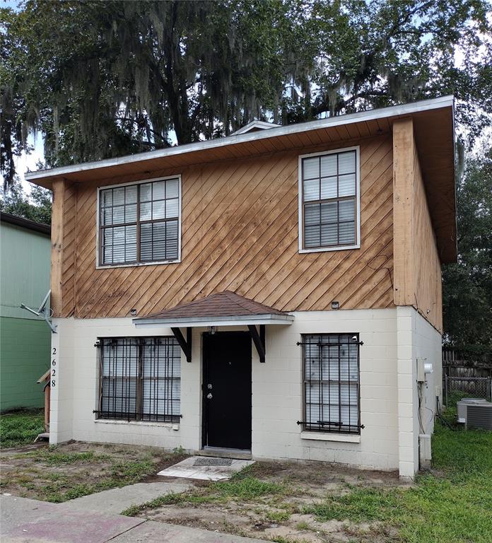 2628 Southwest 31 Place Gainesville, FL 32608 - Photo 1 of 1 a front view of a house with a yard