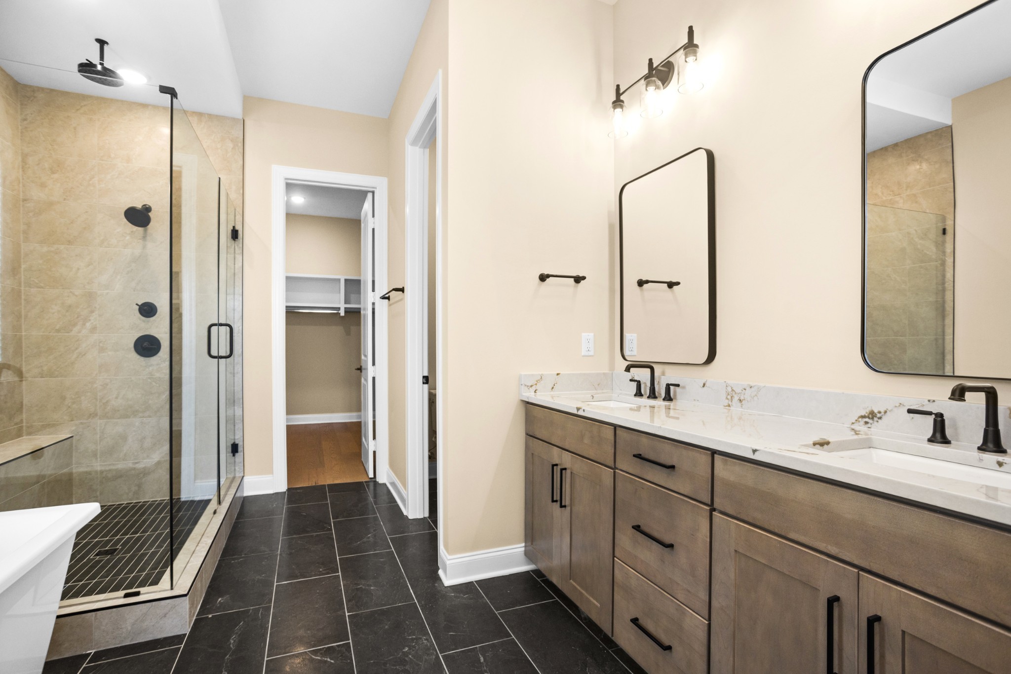 7004 Thunderhead Way Spring Hill, TN 37174 - Photo 29 of 52 a bathroom with a double vanity sink mirror double and shower