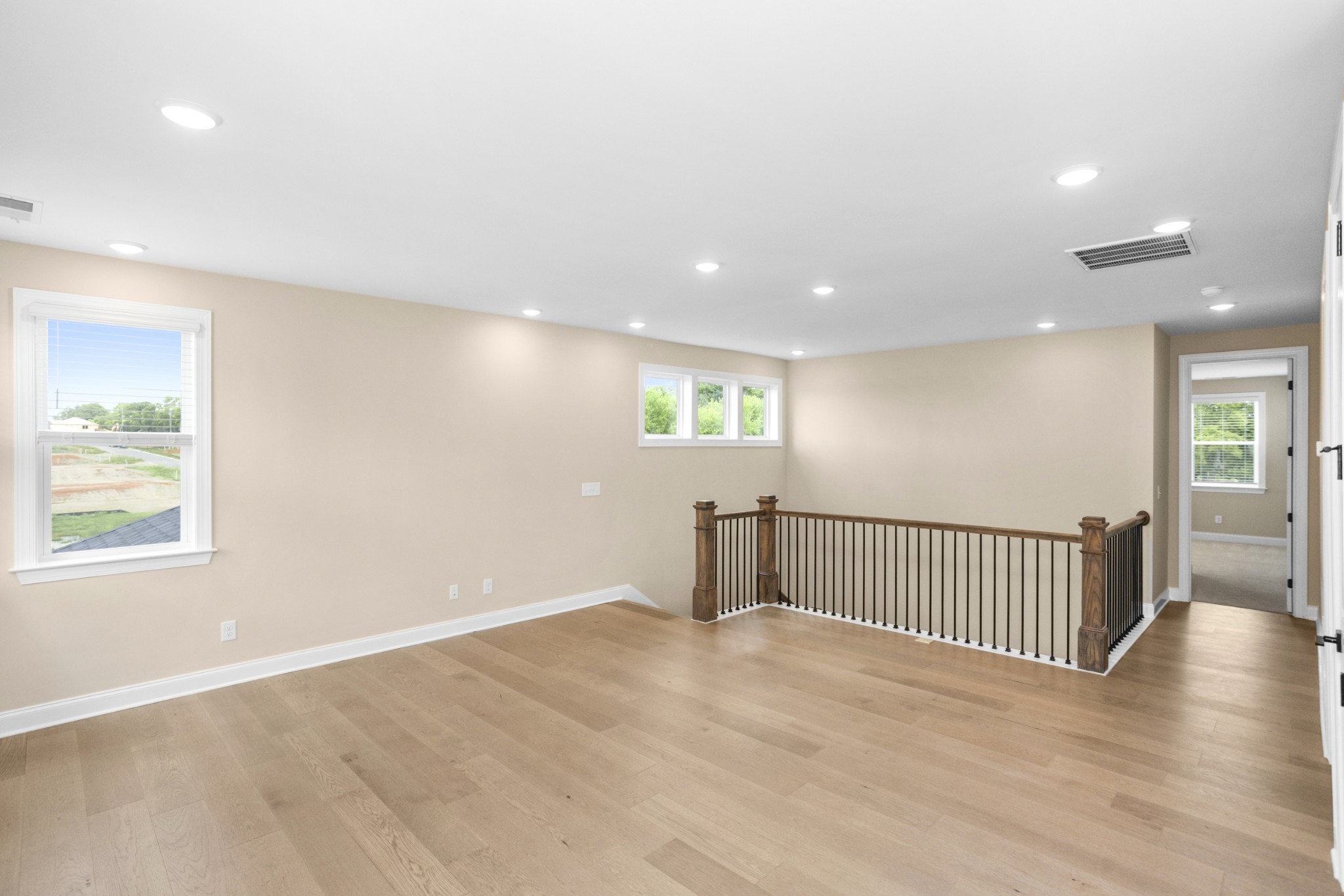 7004 Thunderhead Way Spring Hill, TN 37174 - Photo 35 of 52 an empty room with wooden floor and windows