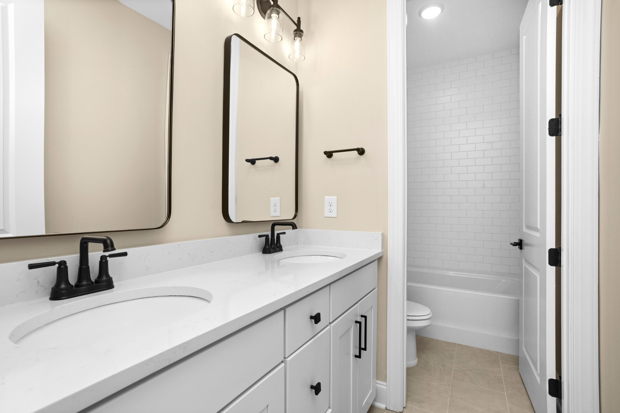 7004 Thunderhead Way Spring Hill, TN 37174 - Photo 39 of 52 a bathroom with 2 sink and a mirror