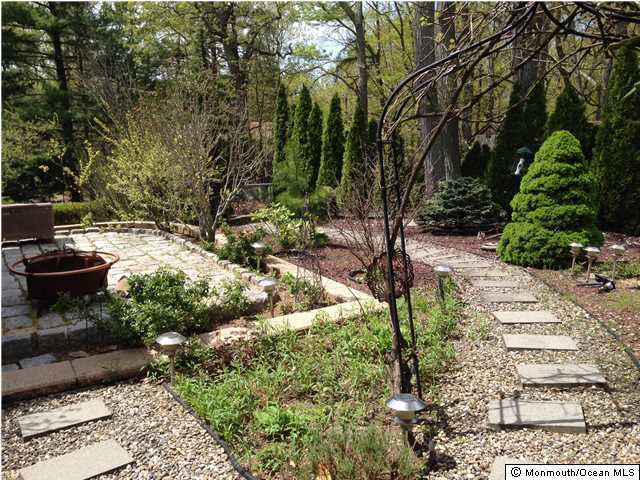 77 Hilltop Road Howell, NJ 07731 - Photo 22 of 25 a view of a garden with flowers