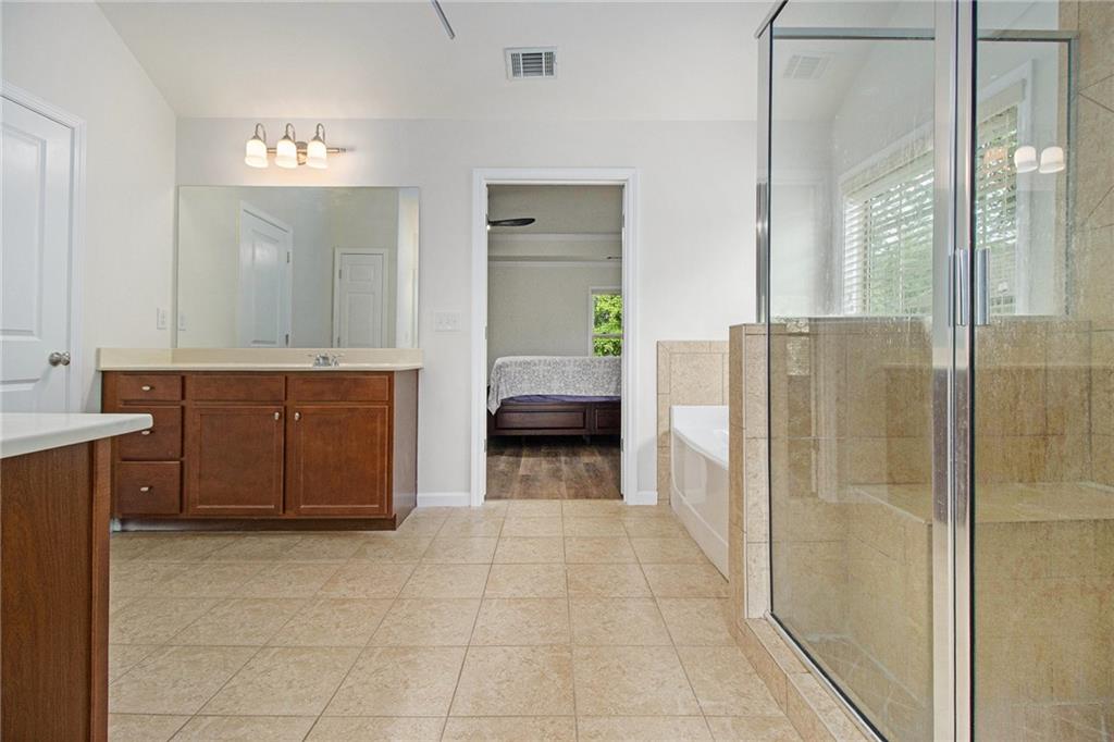218 Third Avenue Avondale Estates, GA 30002 - Photo 22 of 26 a bathroom with a tub a sink and a mirror