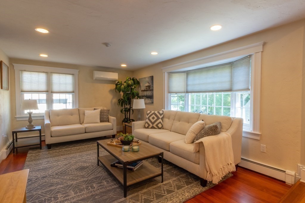182 Marked Tree Road Needham, MA 02492 - Photo 6 of 21 a living room with furniture and a large window