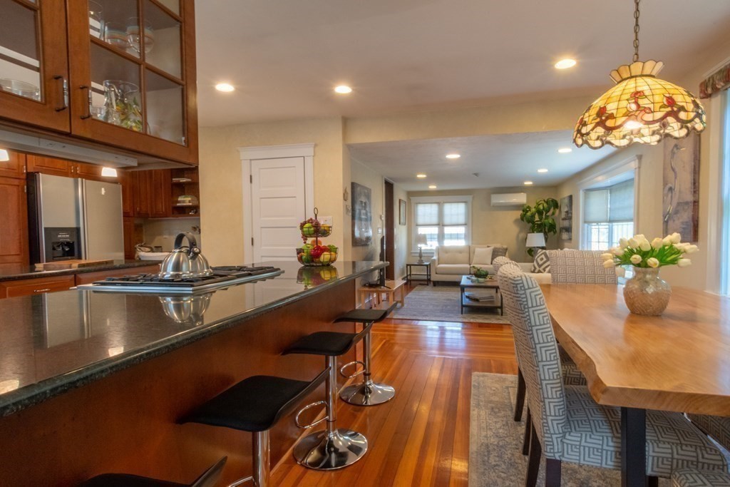 182 Marked Tree Road Needham, MA 02492 - Photo 9 of 21 a kitchen with counter space dining table and chairs