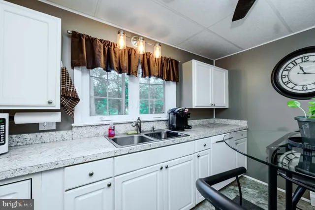 a bedroom with a large bed and a flat tv screen