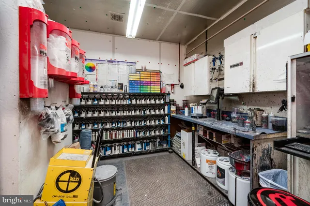 a room with a flat screen tv and a stove