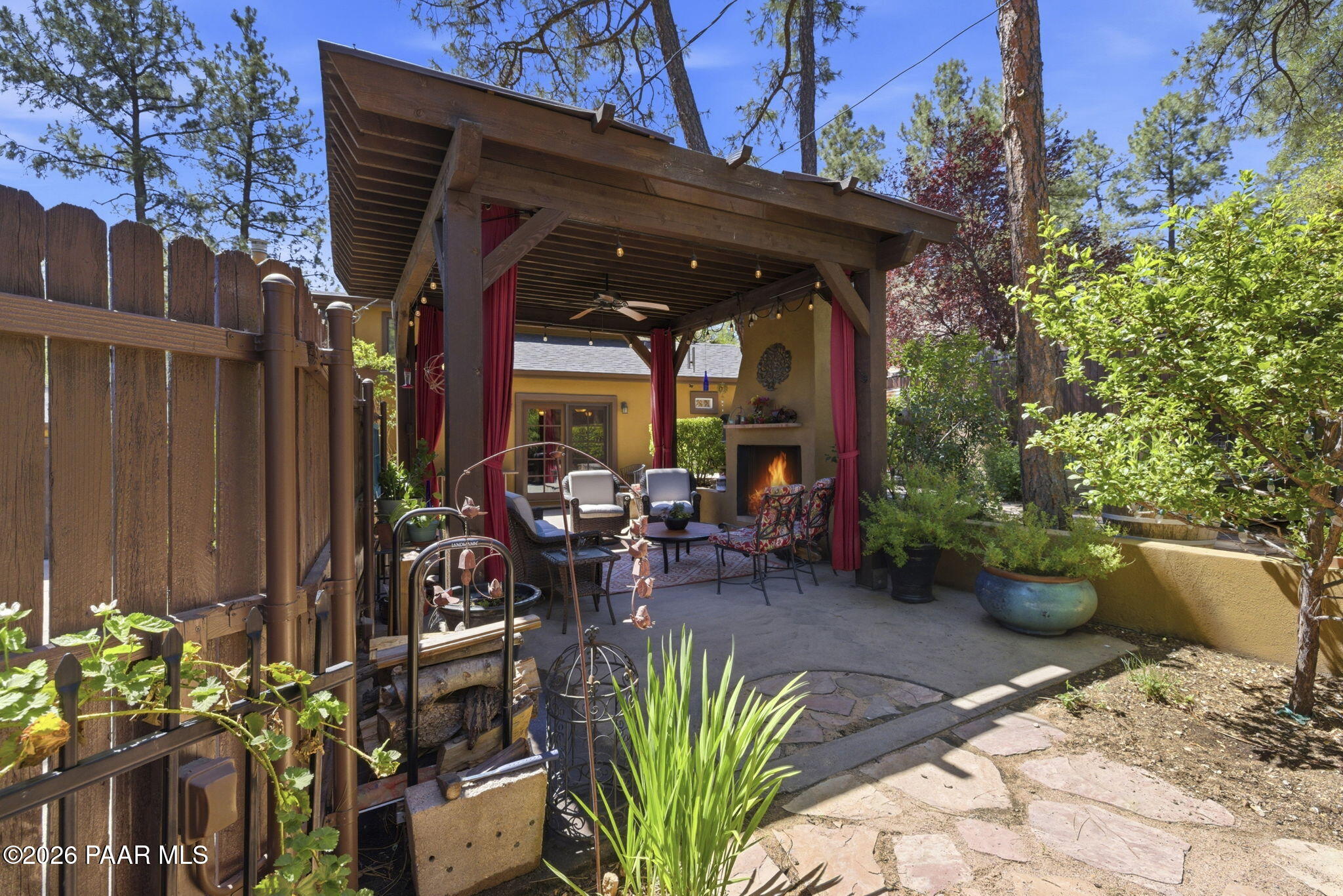 535 Copper Basin Road Prescott, AZ 86303 - Photo 38 of 41 a view of a patio with table and chairs potted plants