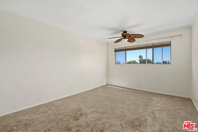 a front view of a house with a ceiling fan