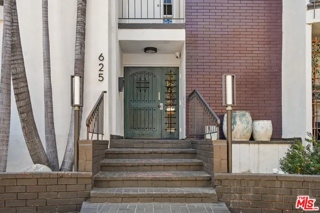 a front view of a house with entryway and stairs