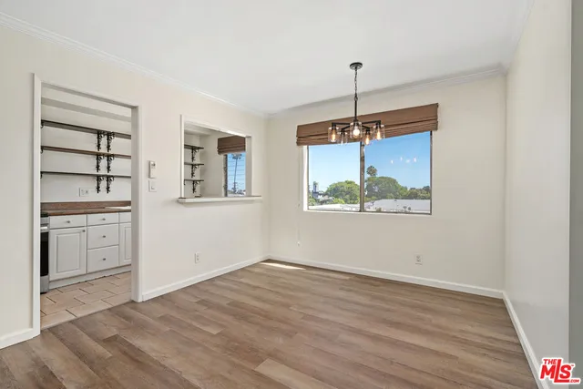 a view of a kitchen with a dishwasher cabinets and wooden floor