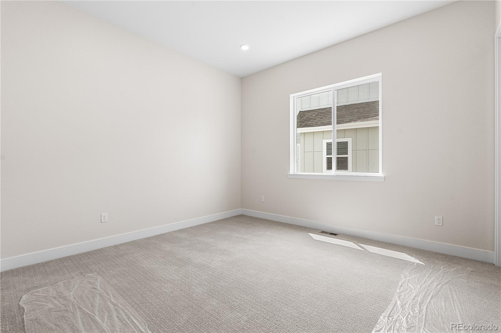 7392 Timberstone Street Castle Pines, CO 80108 - Photo 17 of 42 an empty room with a window