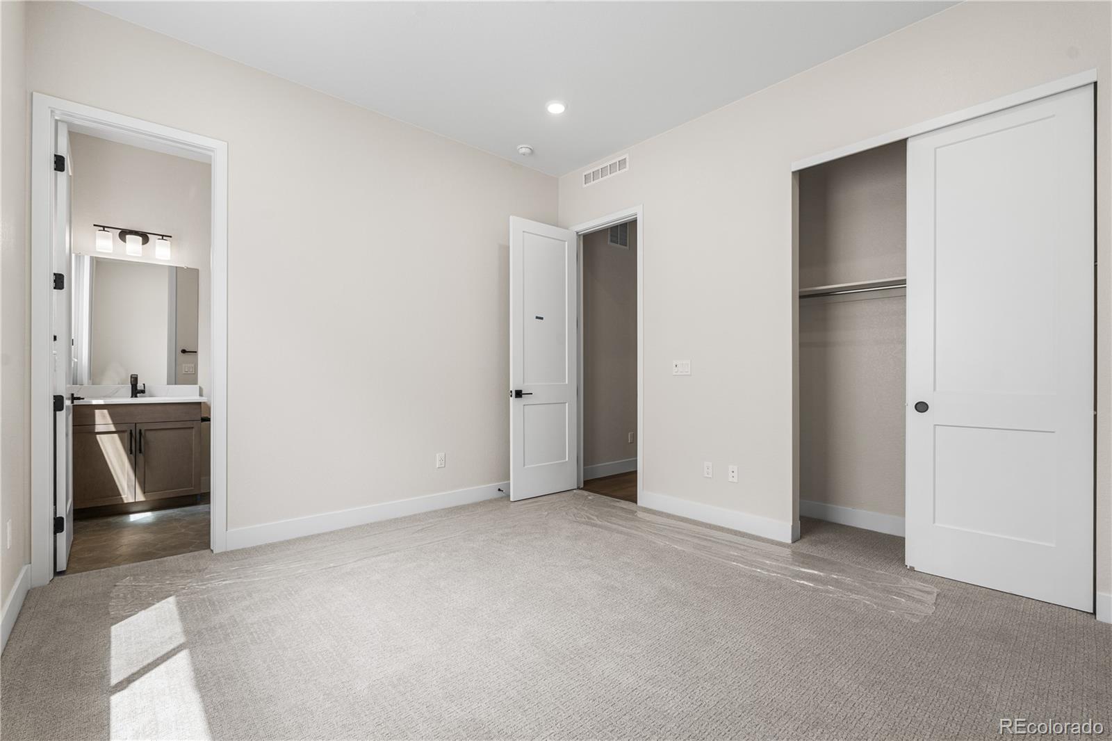 7392 Timberstone Street Castle Pines, CO 80108 - Photo 18 of 42 a view of an empty room with a bathroom