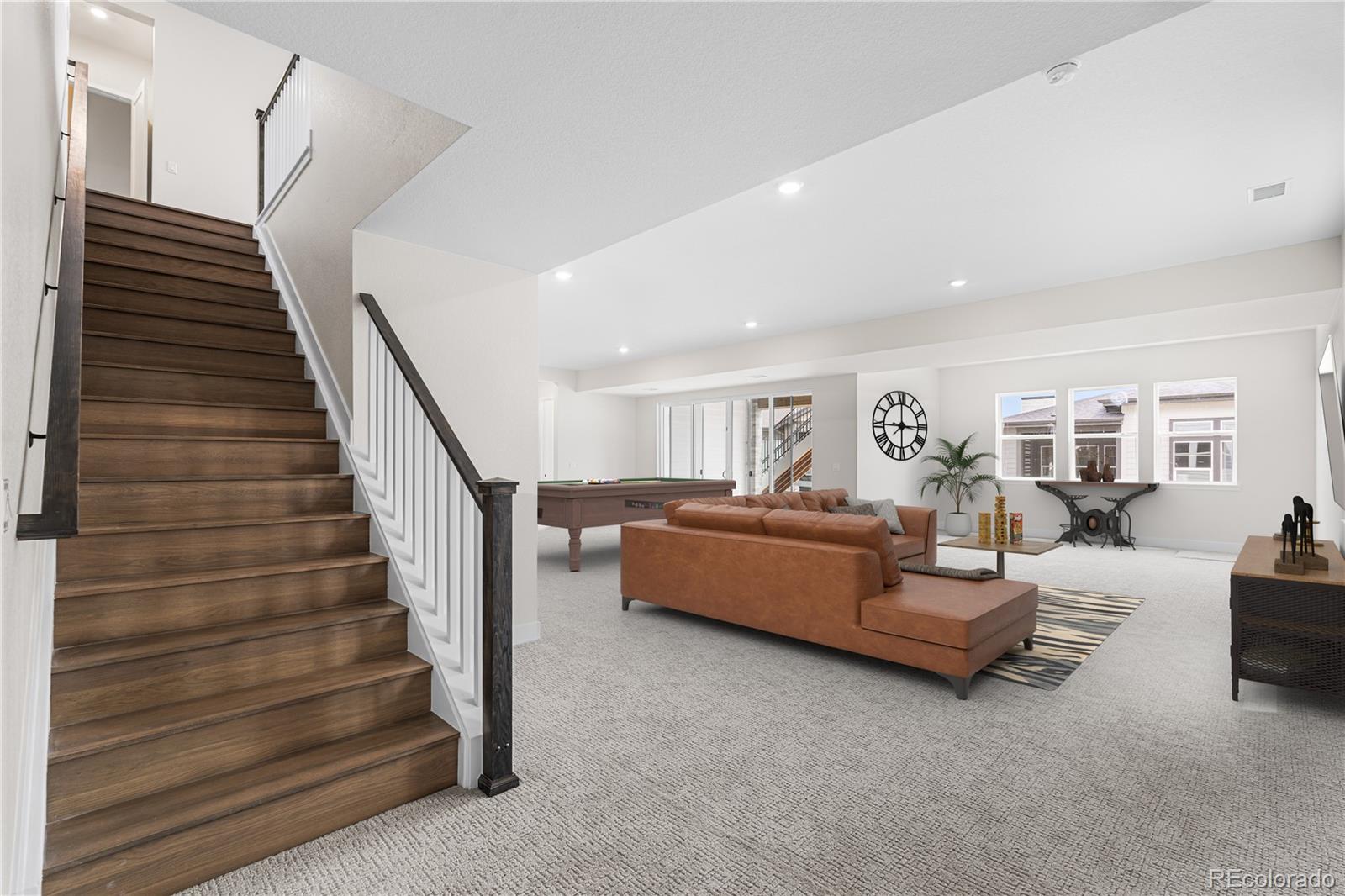 7392 Timberstone Street Castle Pines, CO 80108 - Photo 24 of 42 a living room with furniture and stairs