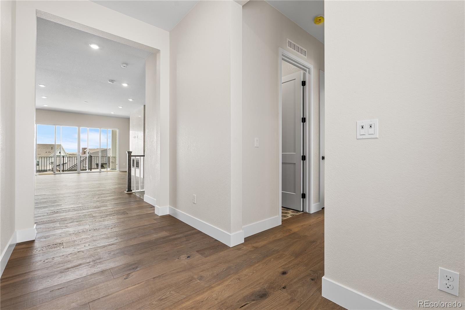 7392 Timberstone Street Castle Pines, CO 80108 - Photo 29 of 42 a view of a hallway with wooden floor