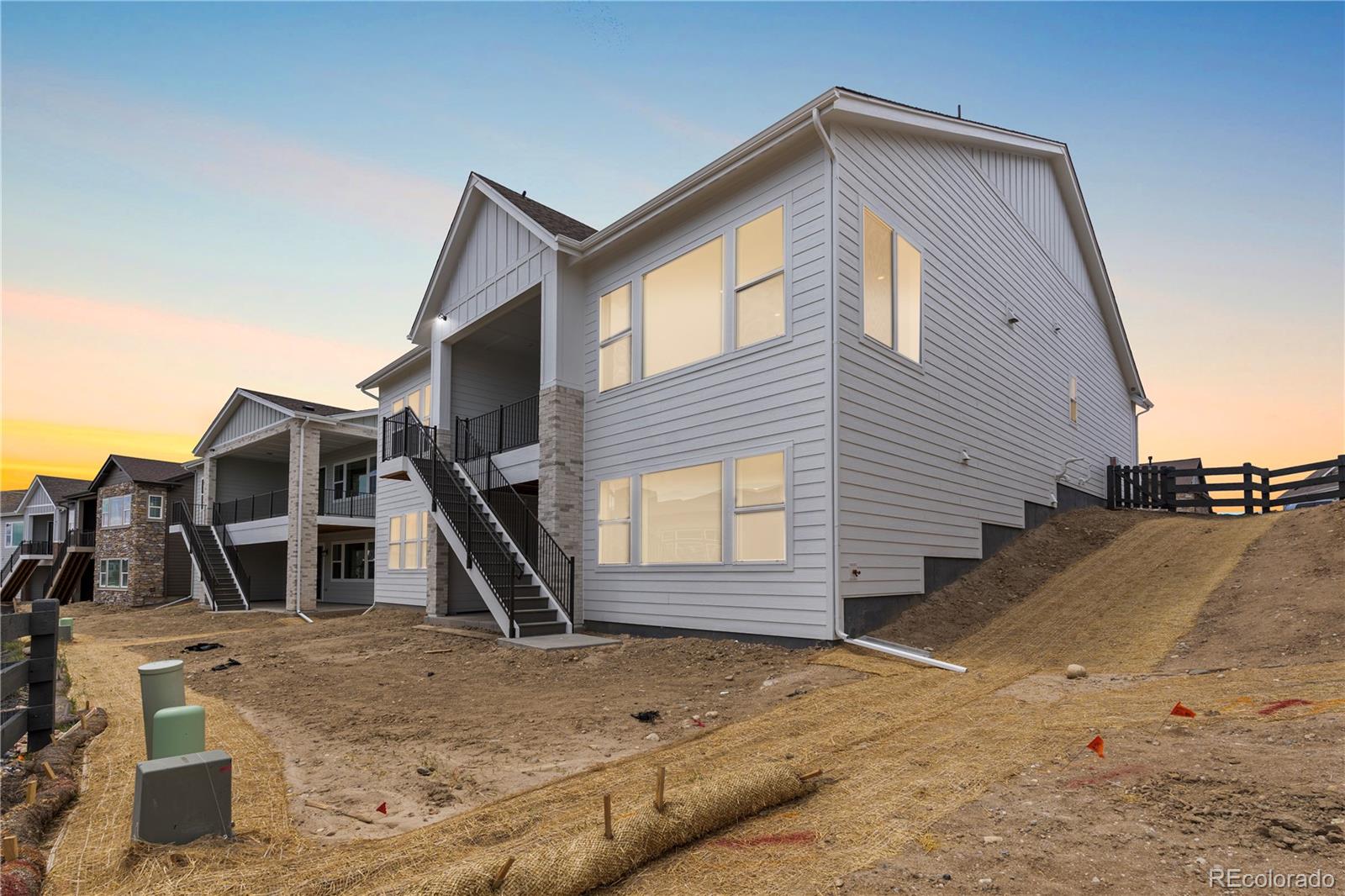 7392 Timberstone Street Castle Pines, CO 80108 - Photo 3 of 42 a front view of a house with a yard