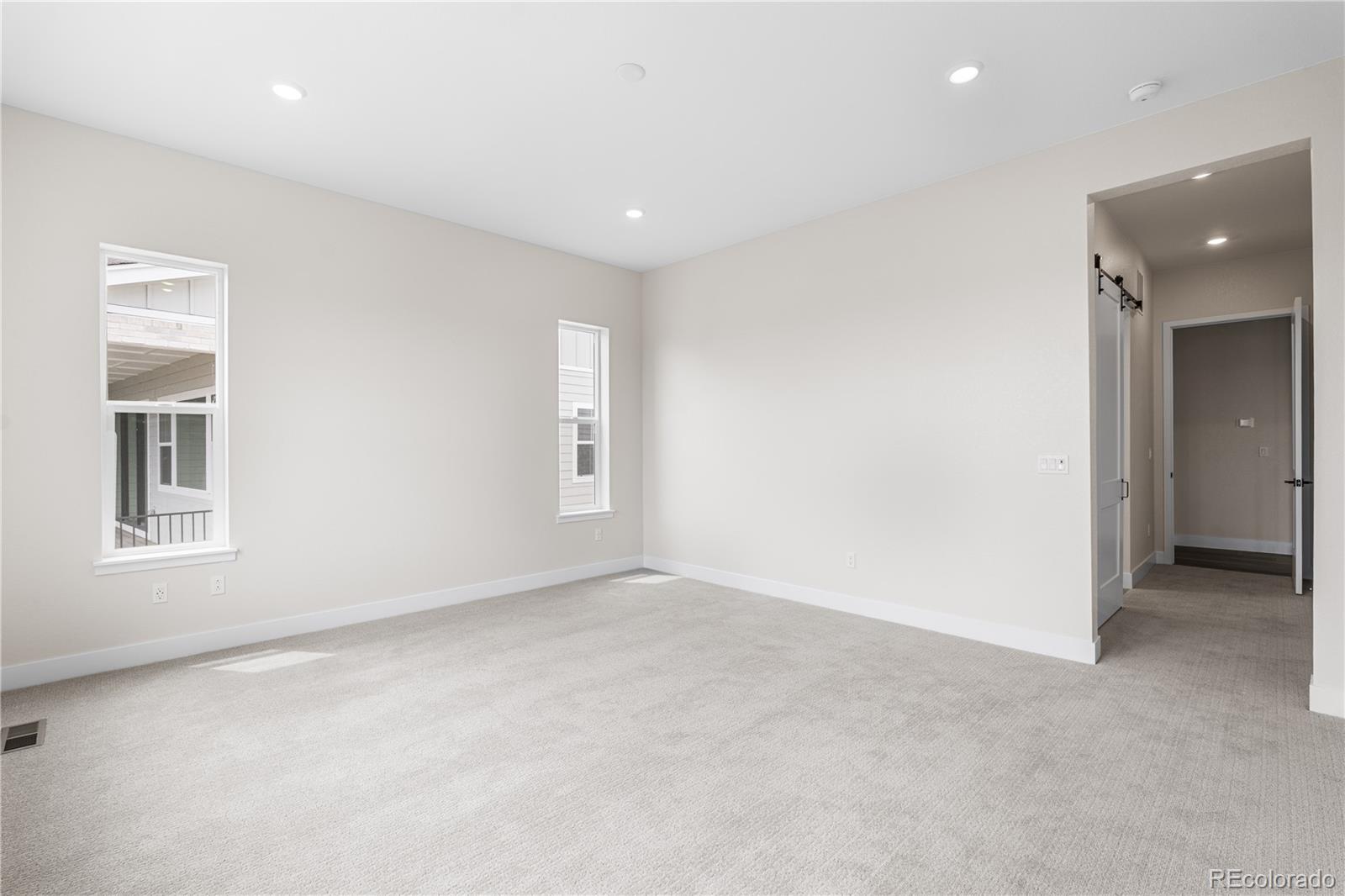 7392 Timberstone Street Castle Pines, CO 80108 - Photo 38 of 42 an empty room with windows and closet
