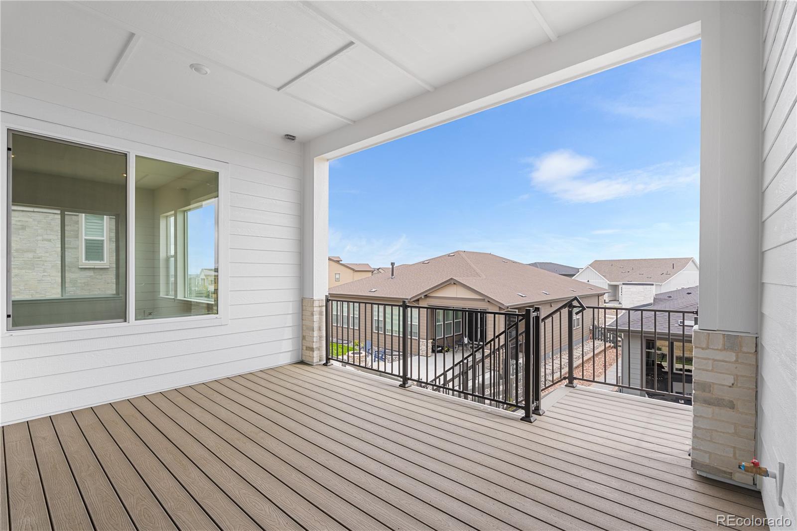 7392 Timberstone Street Castle Pines, CO 80108 - Photo 4 of 42 a view of a balcony with wooden floor