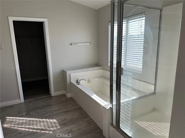 a bathroom with a bathtub and shower