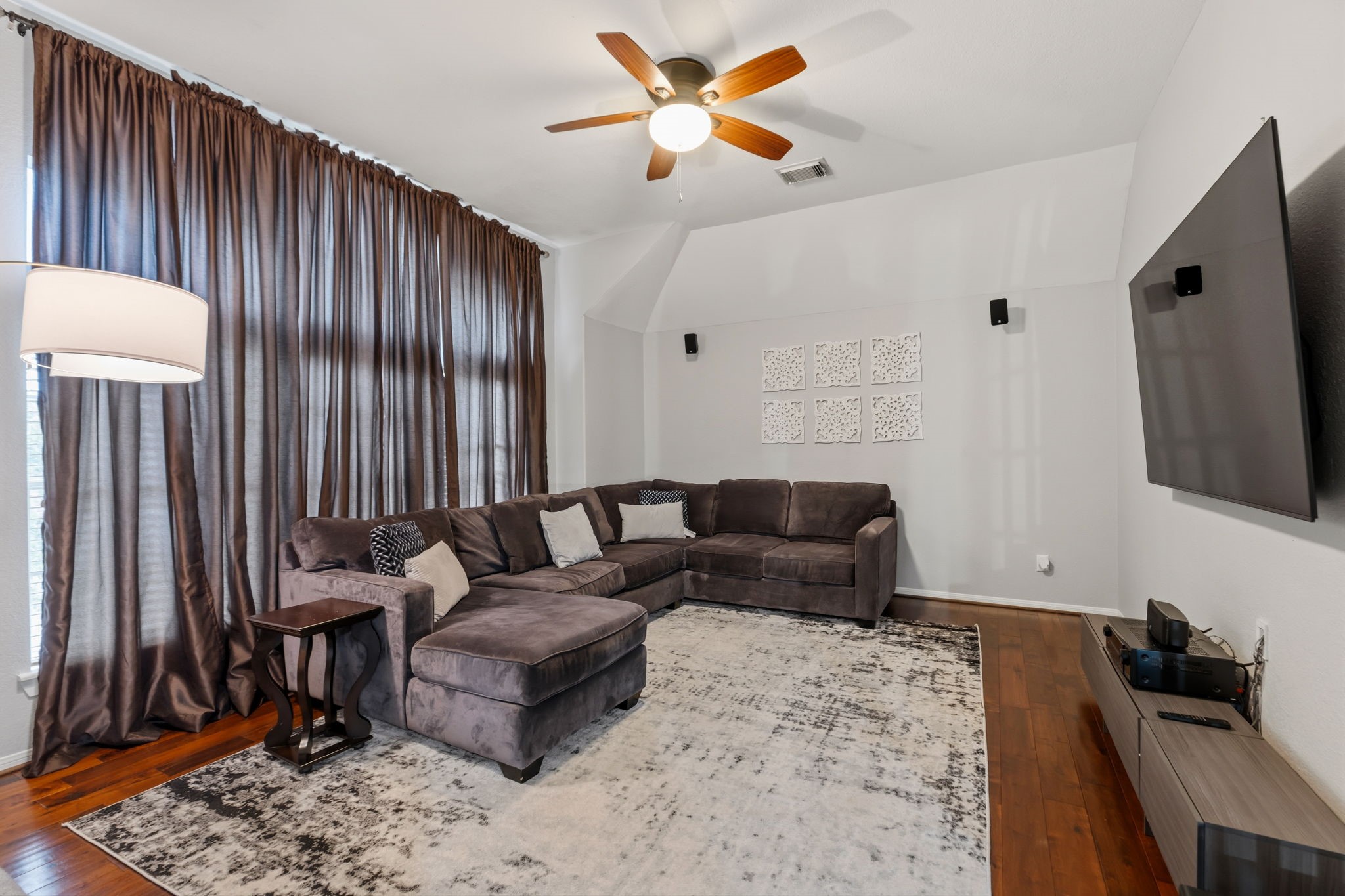 20102 Windbury Court Spring, TX 77379 - Photo 23 of 49 a living room with furniture and a flat screen tv