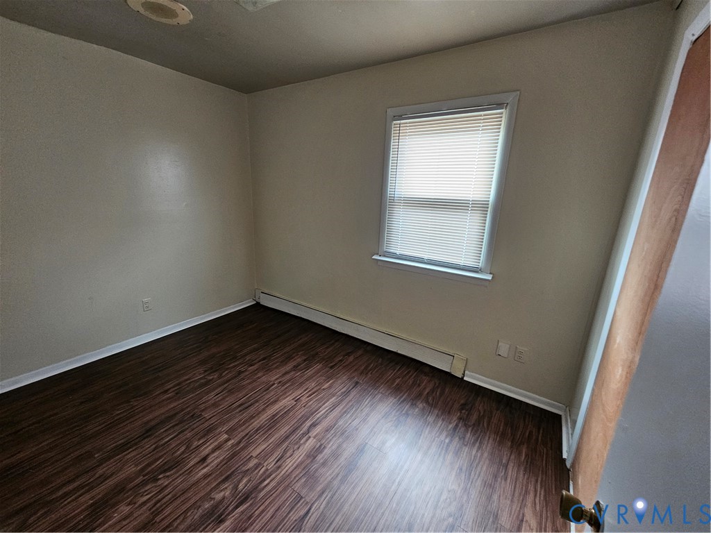 2310 4th Avenue Richmond, VA 23222 - Photo 5 of 9 an empty room with wooden floor and windows