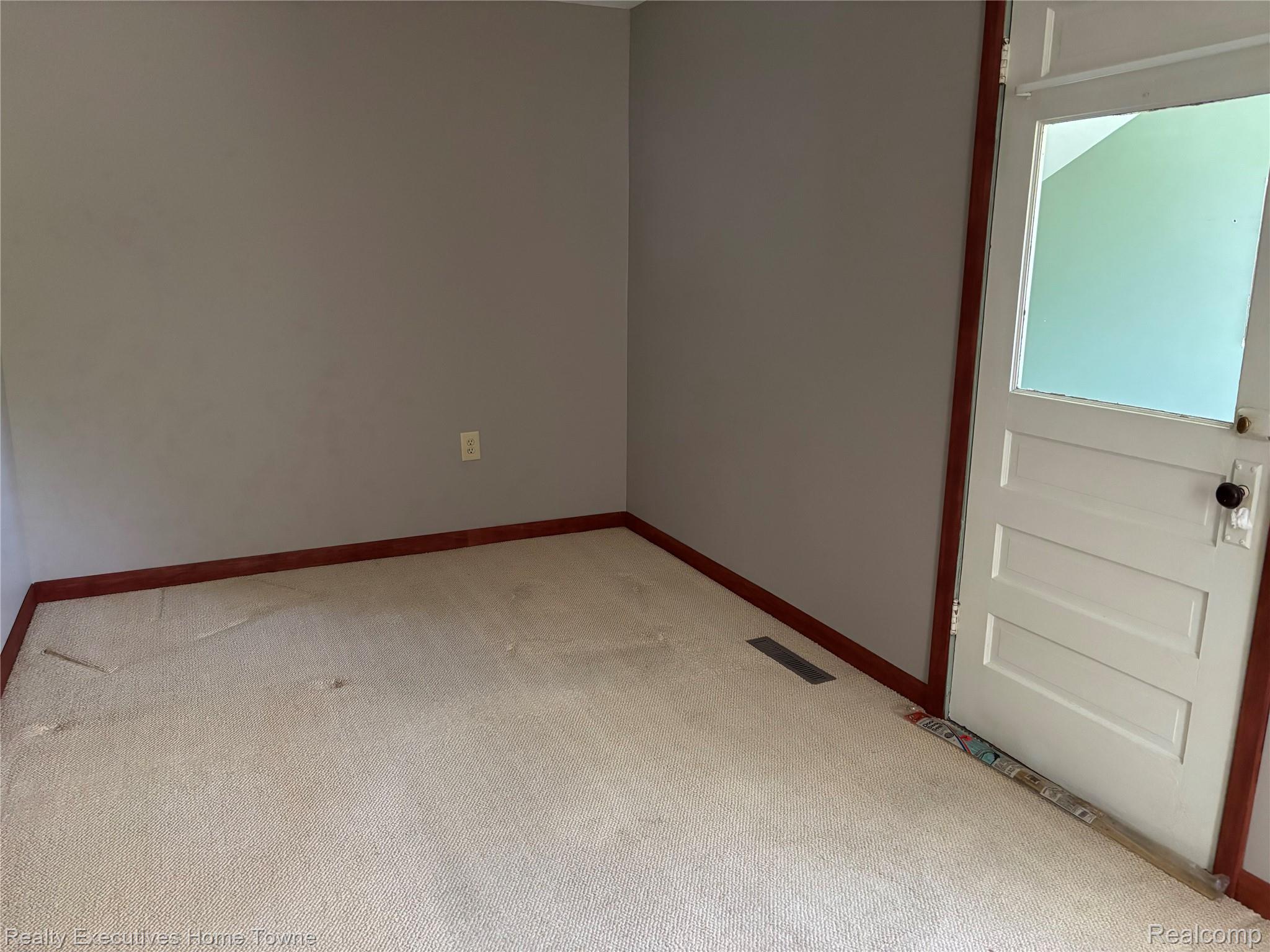 1782 Maple Road Smiths Creek, MI 48074 - Photo 27 of 30 Living room featuring light carpet and baseboards