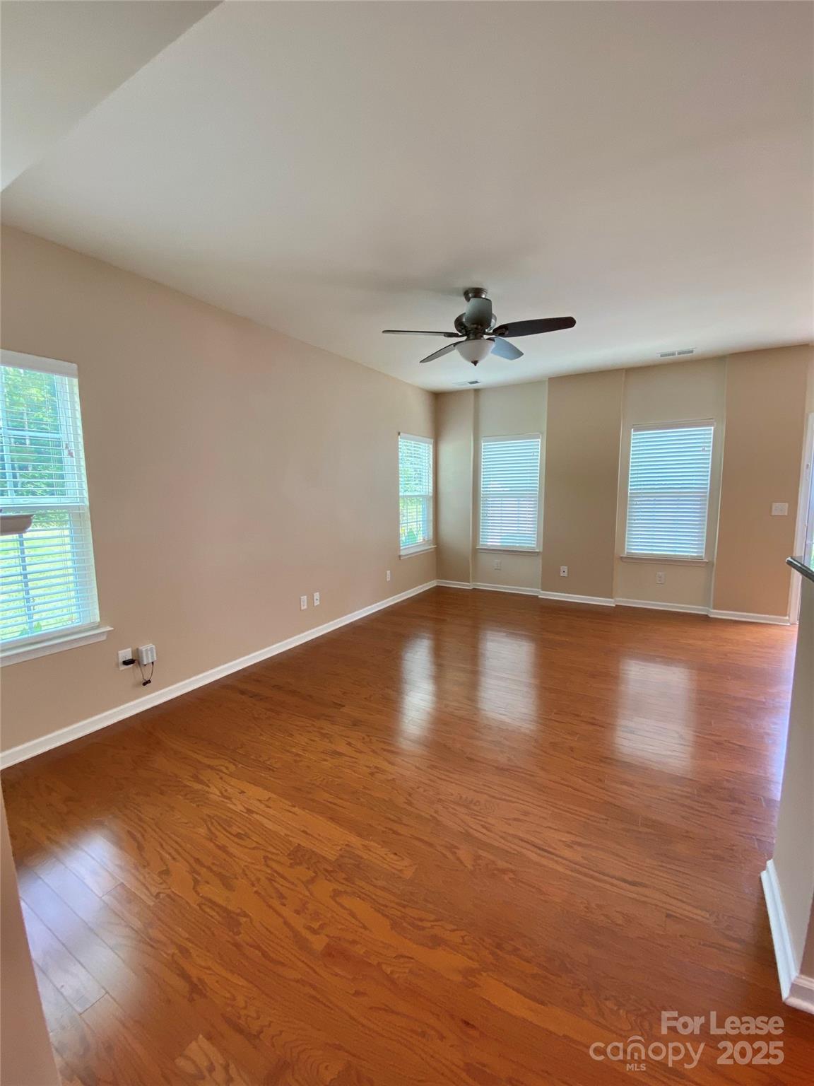 2601 Silverthorn Drive Charlotte, NC 28273 - Photo 8 of 36 a view of a room with wooden floor and window
