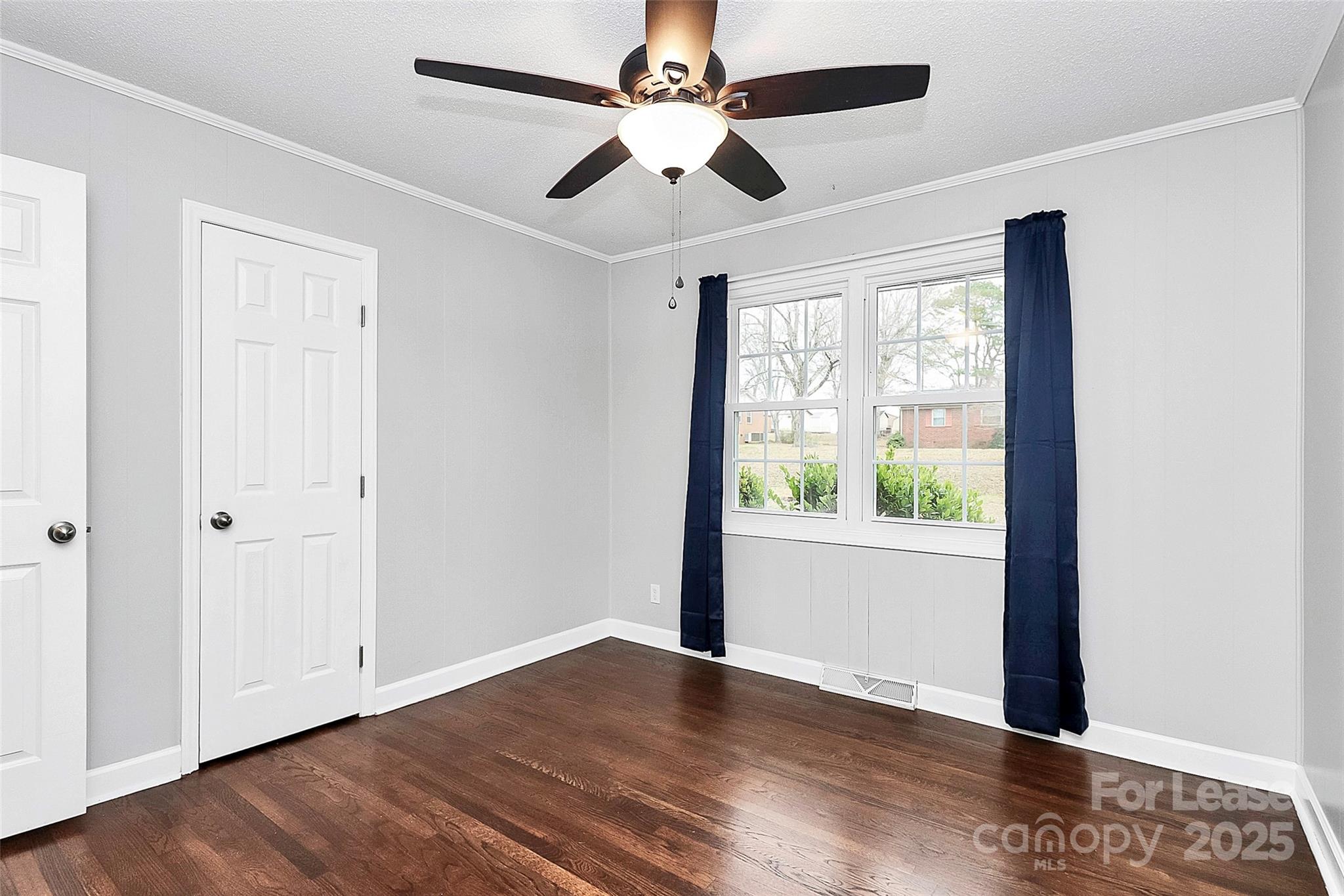 4103 Little Mountain Road Gastonia, NC 28056 - Photo 17 of 20 a view of an empty room with wooden floor and a window