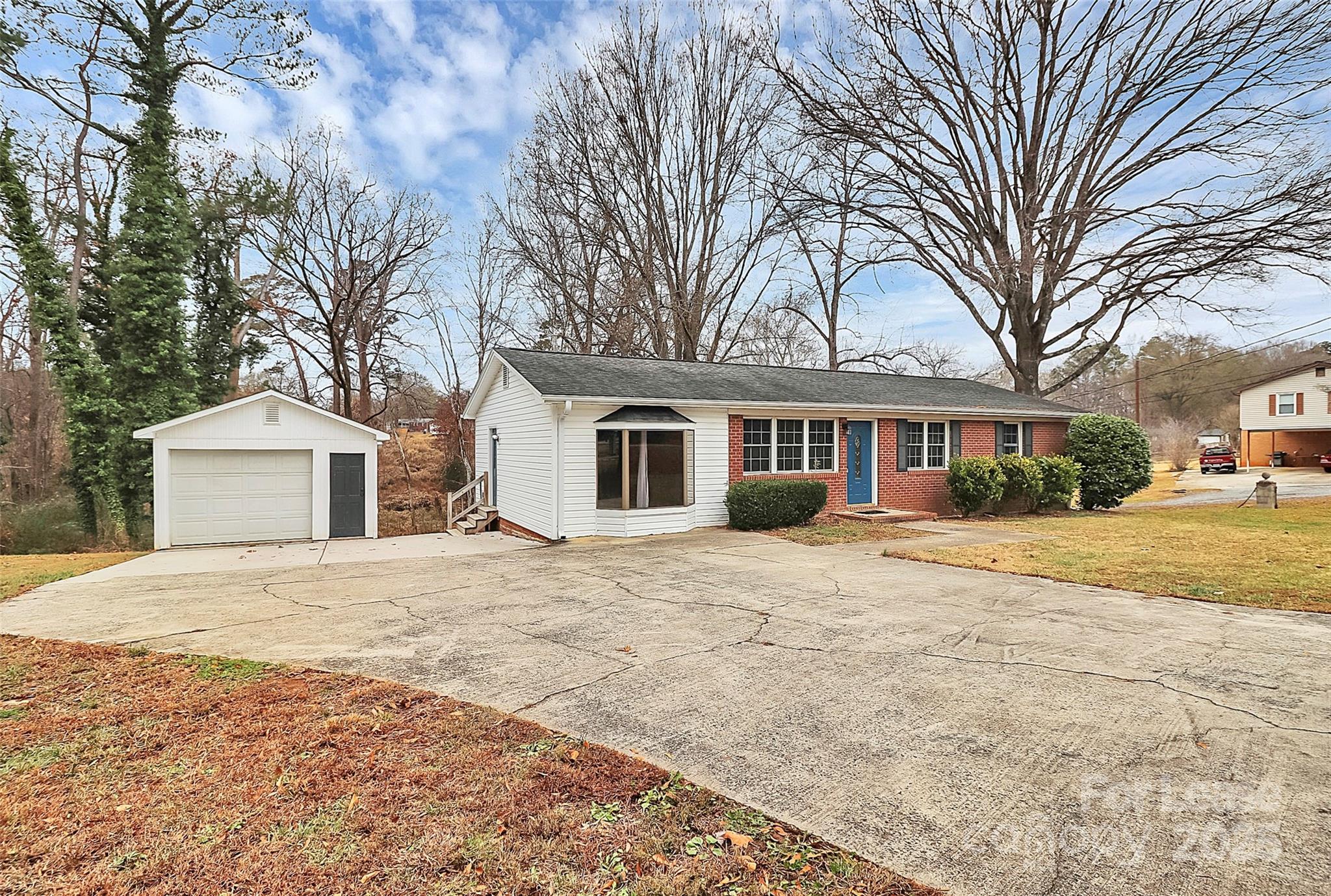 4103 Little Mountain Road Gastonia, NC 28056 - Photo 2 of 20 a front view of a house with a yard