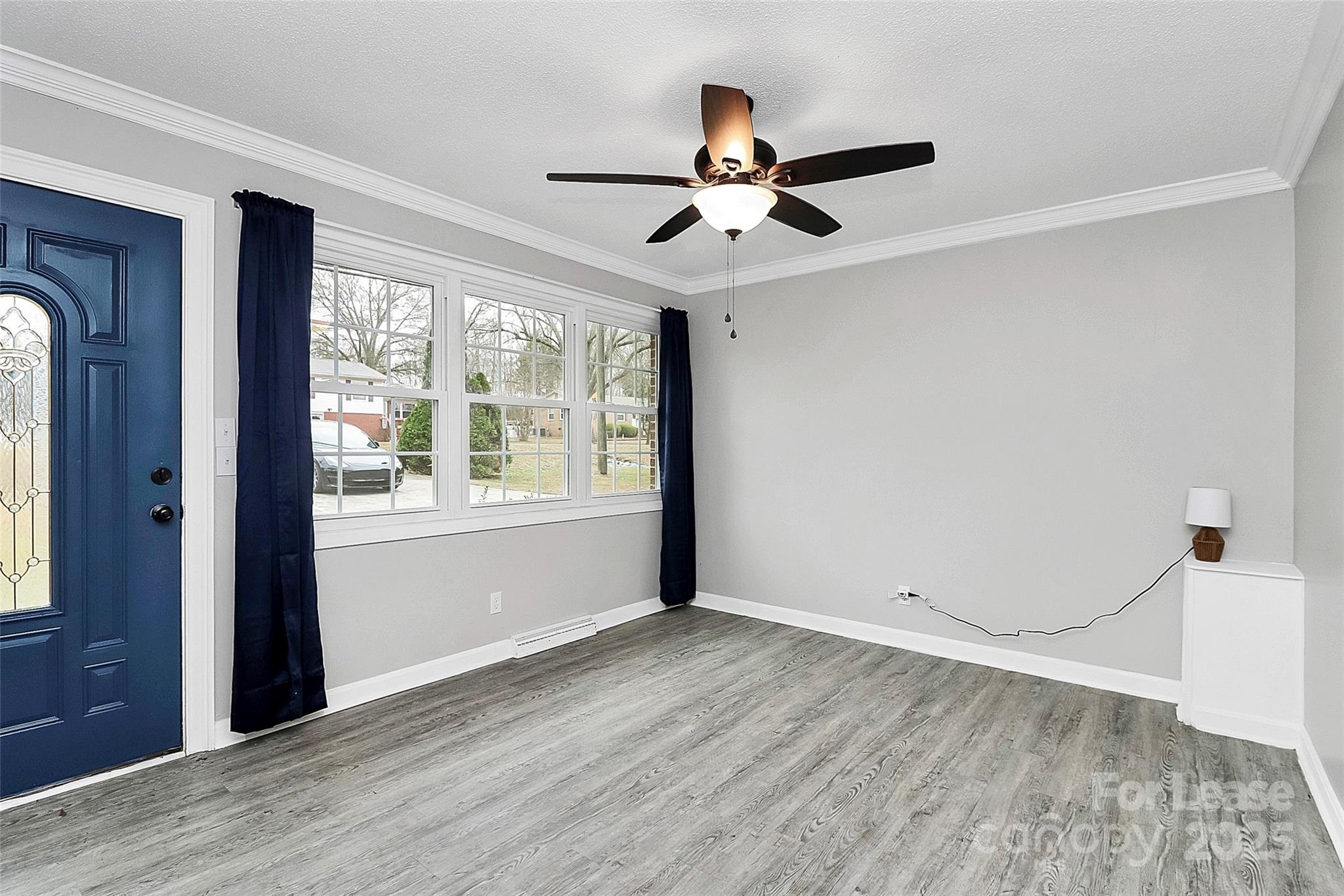 4103 Little Mountain Road Gastonia, NC 28056 - Photo 3 of 20 a view of empty room with wooden floor and fan