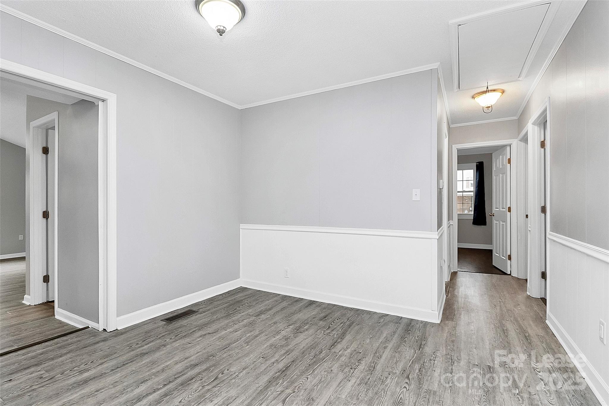 4103 Little Mountain Road Gastonia, NC 28056 - Photo 7 of 20 wooden floor in an empty room with a window