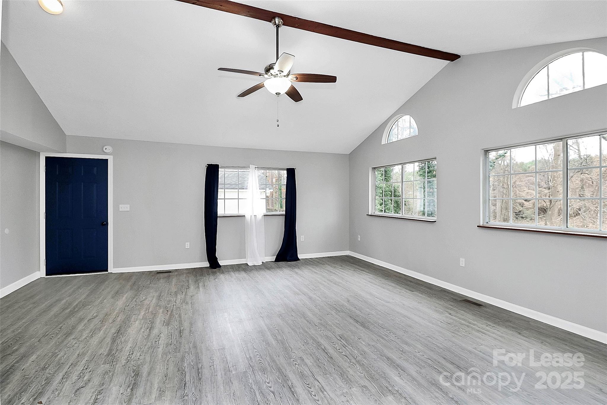 4103 Little Mountain Road Gastonia, NC 28056 - Photo 8 of 20 a view of an empty room with wooden floor and a window