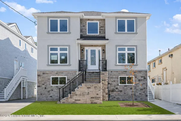a front view of a house with brick walls