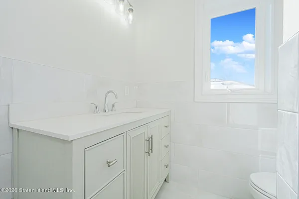 a kitchen with a stove a sink and a microwave