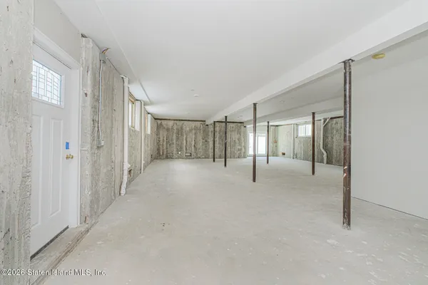 a dining room with a stove a sink and a microwave