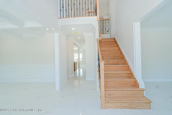 a view of a hallway with staircase