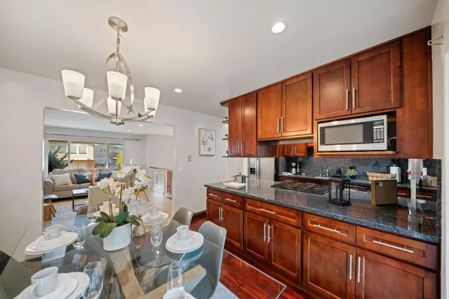 a bedroom with a bed and a potted plant