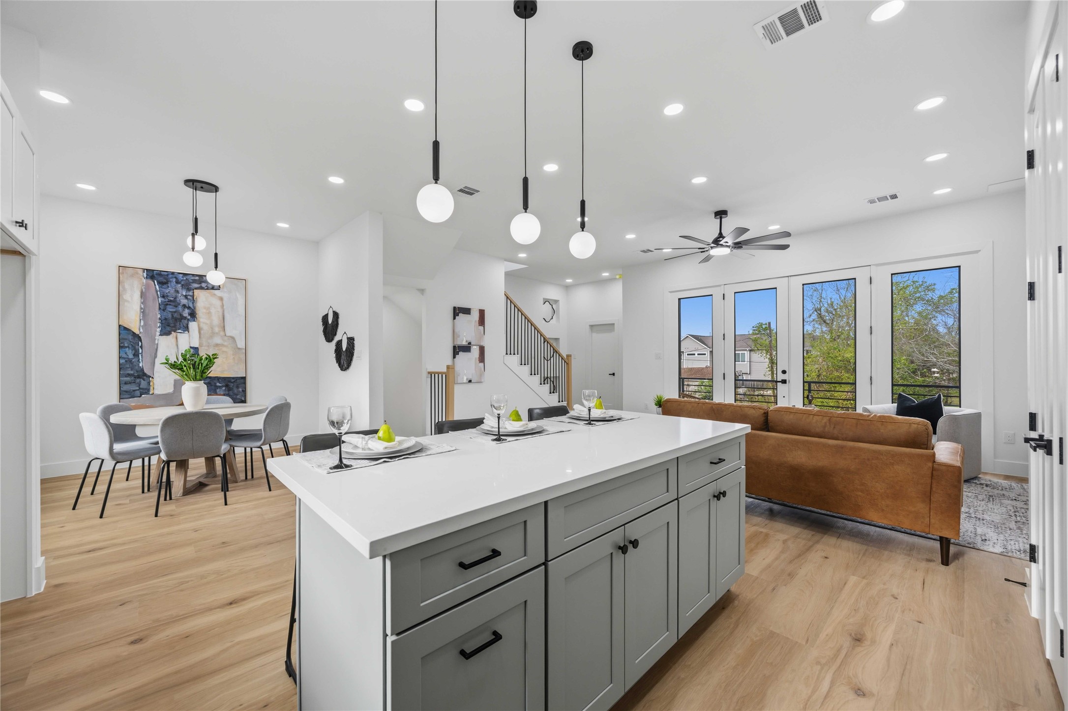 2014 Yates Street Houston, TX 77020 - Photo 15 of 45 a large kitchen with kitchen island a island a sink a stove and wooden floor