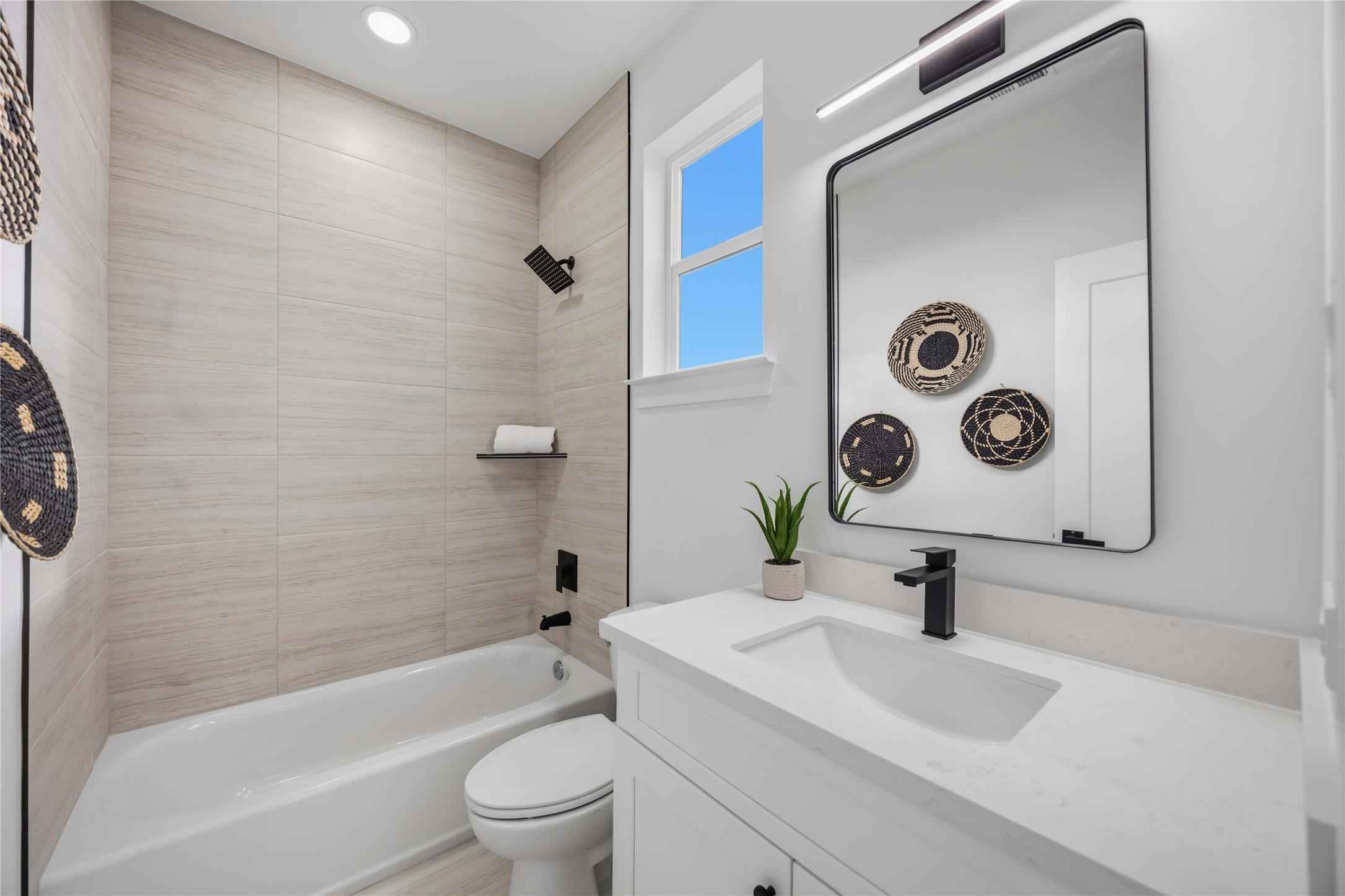 2014 Yates Street Houston, TX 77020 - Photo 32 of 45 a bathroom with a sink a toilet and shower