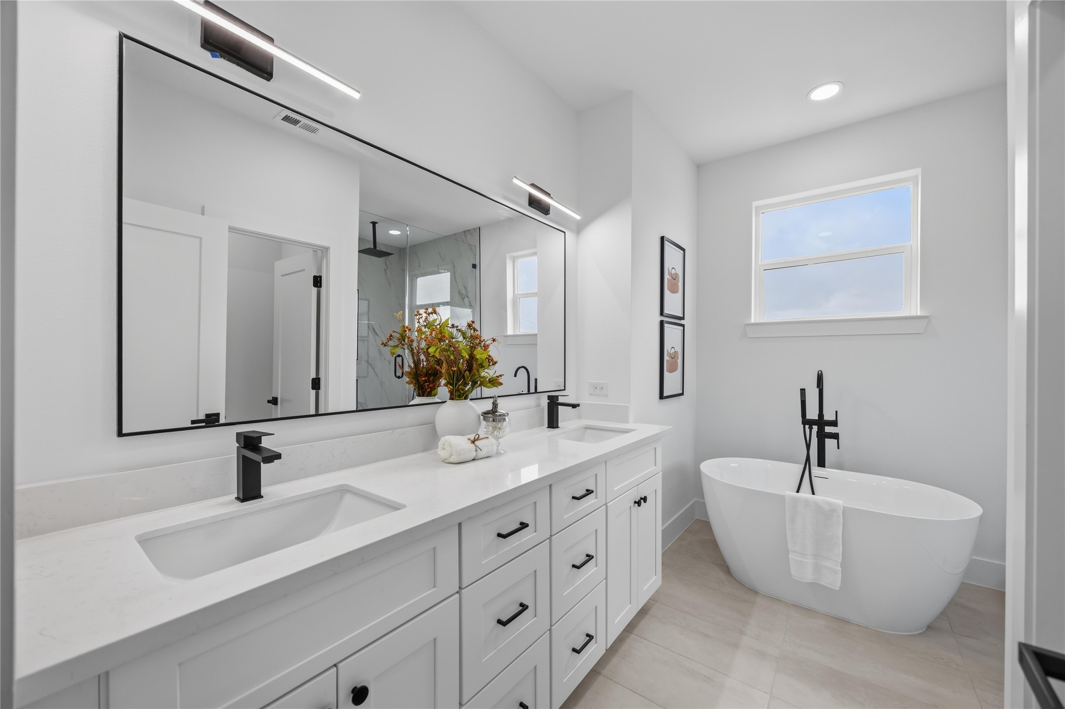 2014 Yates Street Houston, TX 77020 - Photo 39 of 45 a bathroom with a double vanity sink and mirror